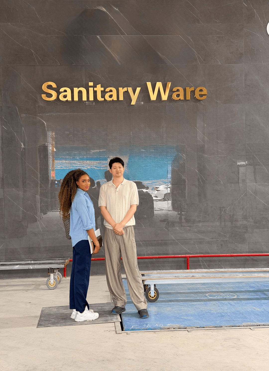 Hakilarte Works with the representative responsible for a ceramic-toilet manufacturing operation